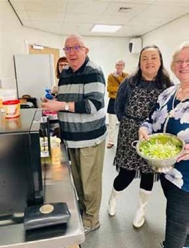 A group of volunteers in the kitchen of the Caritas Centre